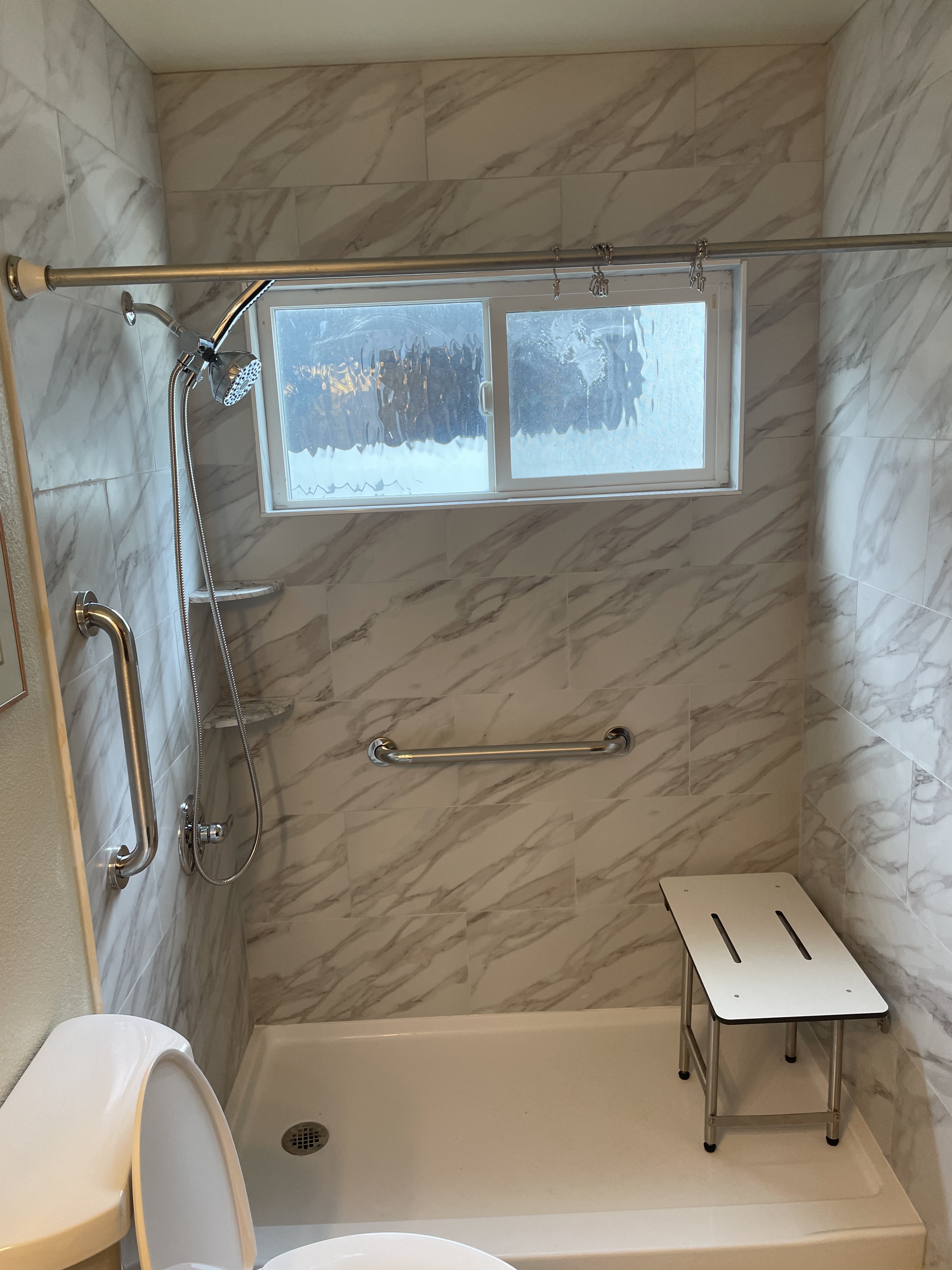 This image shows the After section of a tub to walk in shower conversion as part of our bathroom remodeling services.