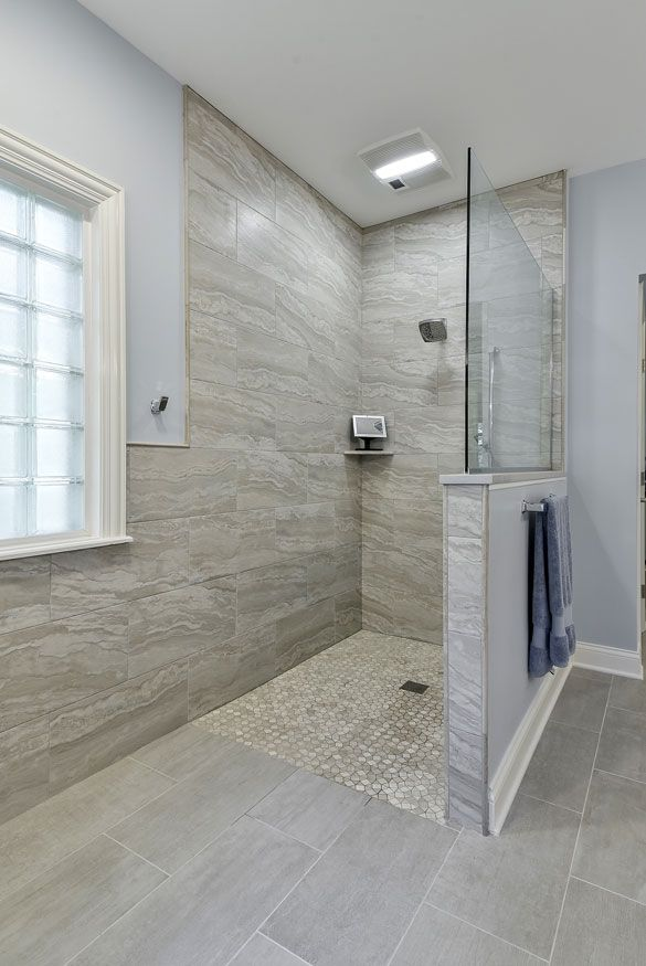 This image shows a walk-in tile shower